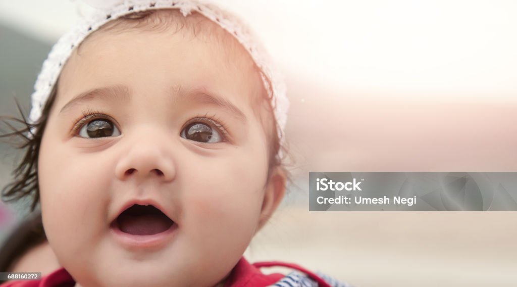 Happy Baby Girl with Background for Copy-Space. Baby - Human Age Stock Photo