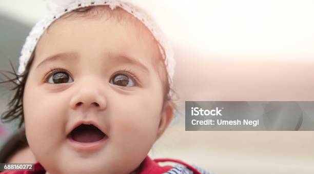 Happy Baby Girl With Background For Copyspace Stock Photo - Download Image Now - Baby - Human Age, Looking Up, Baby Girls