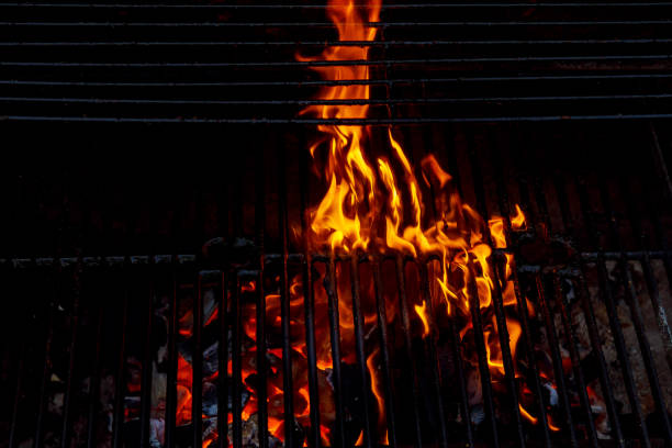 istock Hot Empty Charcoal BBQ Grill With Bright Flames On The Black Background. 688164618