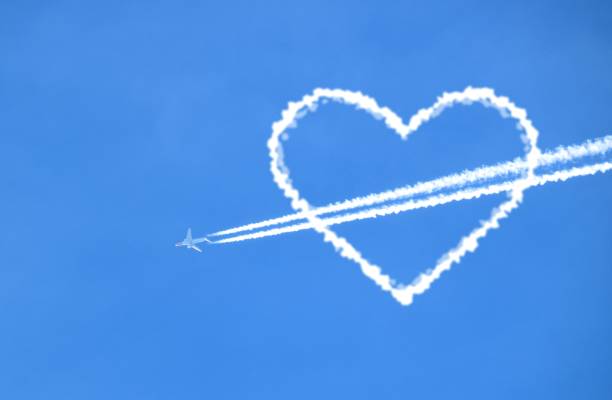 istock plane leaving sky tracks heart shape 688182812