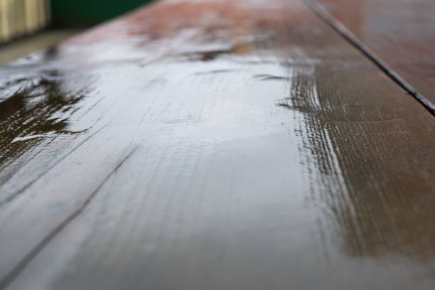 istock Wet wooden table during rain. 688186450
