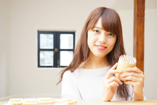 istock Woman with a container with colored pencils 688192516