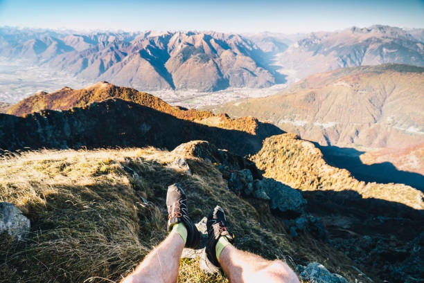 istock View past legs of trail runner to mountain ranges 688196121