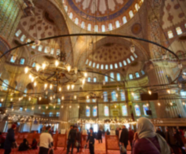 istock blur image of Muslims praying inside Mosque 688199596