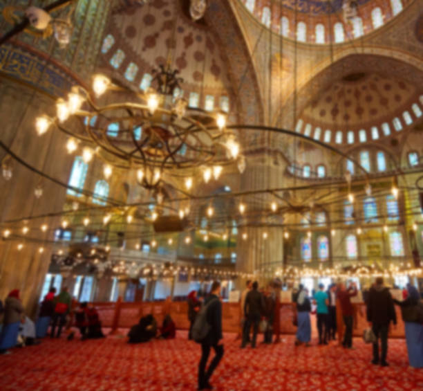 istock blur image of Muslims praying inside Mosque 688199698
