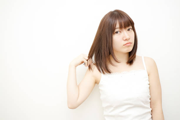 istock Woman touching her hair 688204610