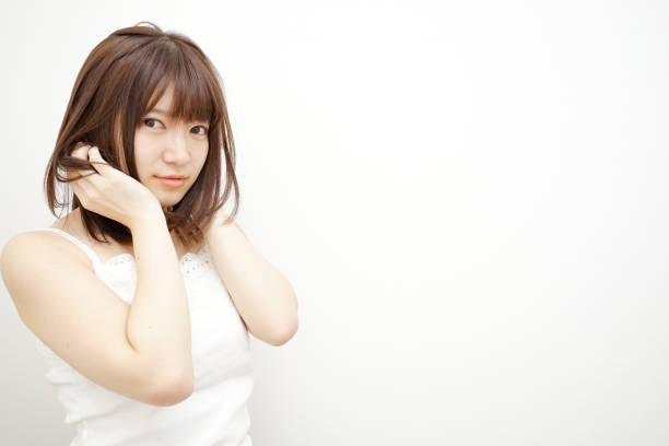 istock Woman touching her hair 688205646