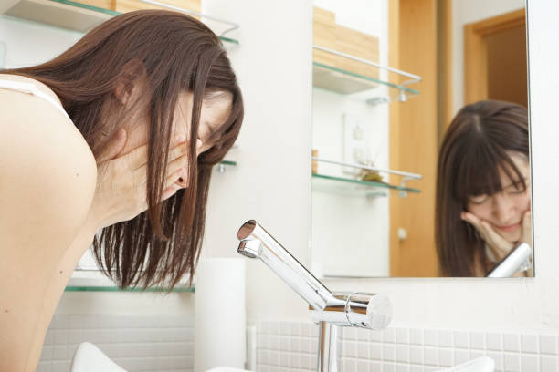 istock Woman washing face 688205958
