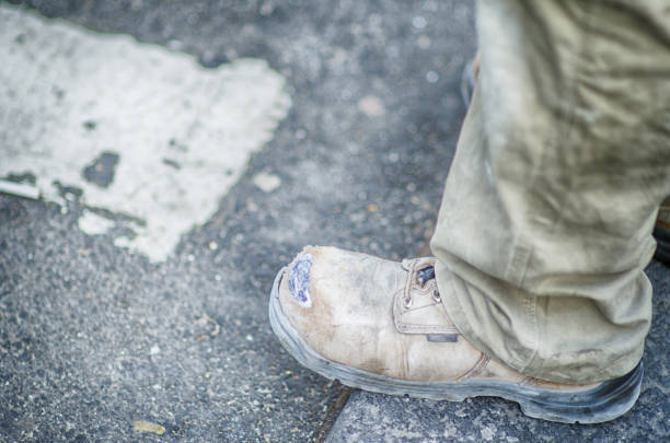 istock Dirty Construction Boot Outdoors on the Street 688206300