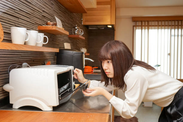 istock Women use the oven 688206380