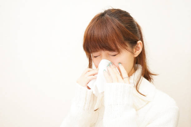 istock Woman blowing nose 688222502