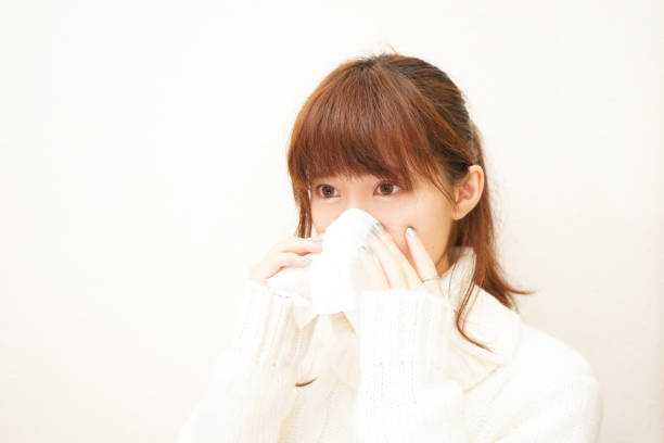 istock Woman blowing nose 688222756