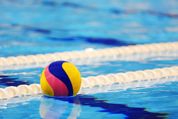 Colorful water ball in swimming-pool Colorful water ball in swimming-pool water polo photos stock pictures, royalty-free photos & images