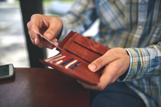 Payment Man buys with a credit card playing card photos stock pictures, royalty-free photos & images