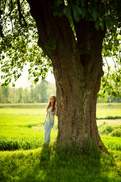 istock Beautiful women relaxing under a chestnut-tree 688230640