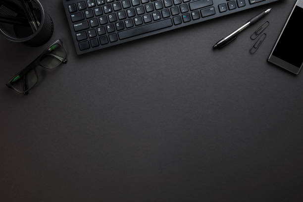 istock Computer Keyboard With Eyeglasses And Office Supply On Gray Desk 688233052