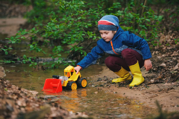 istock little boy playing with toy truck 688233078