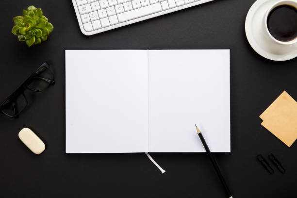 istock Blank Paper Surrounded By Office Supplies On Gray Desk 688233286