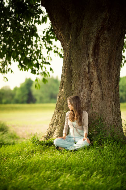 istock Beautiful women relaxing under a chestnut-tree 688234182