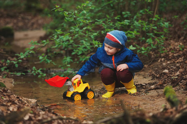 istock little boy playing with toy truck 688234328