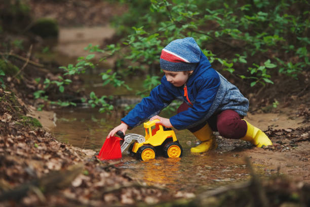 istock little boy playing with toy truck 688234452