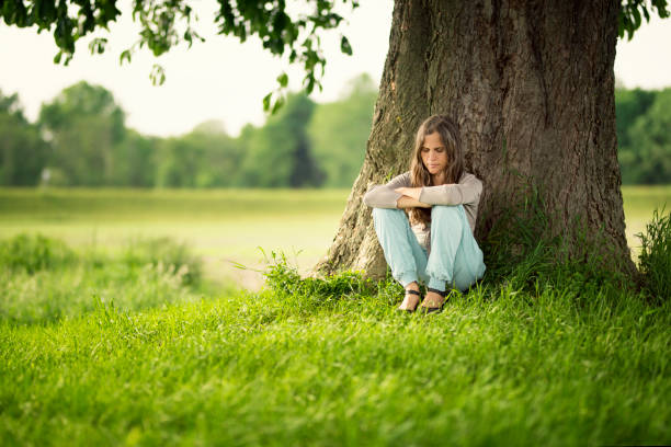 istock Beautiful women relaxing under a chestnut-tree 688242984