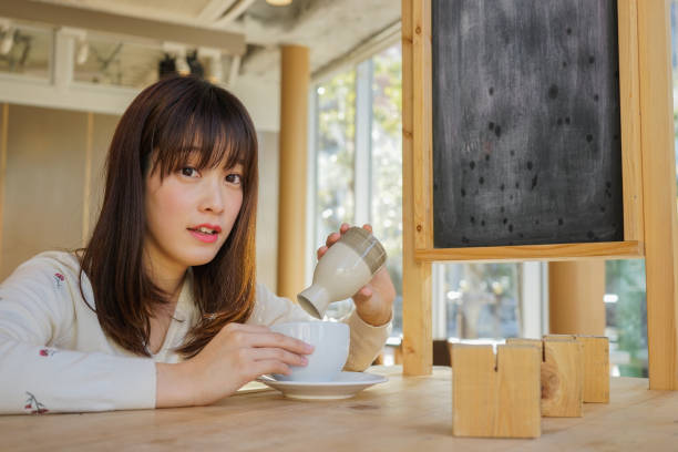 istock Woman with a sake carafes 688243842