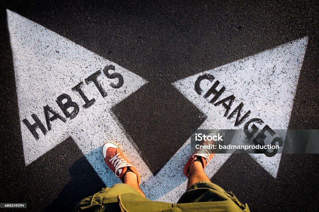 Dilemma concept Red shoes from above on the white arrows,dilemmas concept habits or changes Addiction Stock Photo