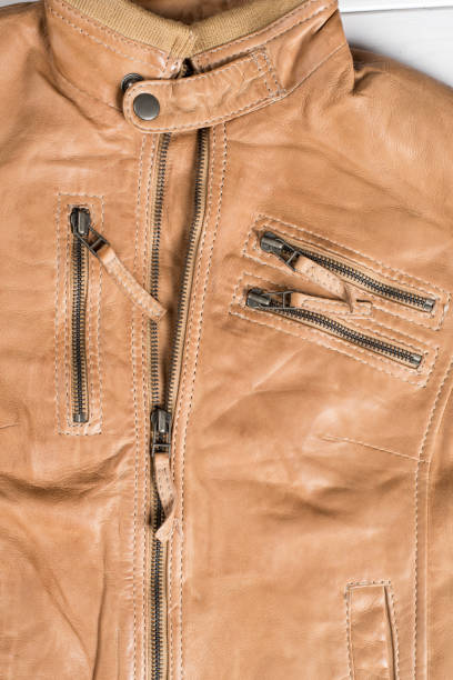 istock Light brown leather jacket. Beige color leather jacket on hanger 688252370