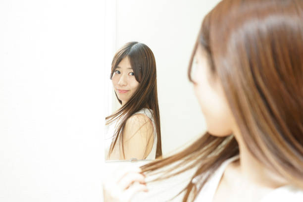 istock Women in front of the mirror 688252734