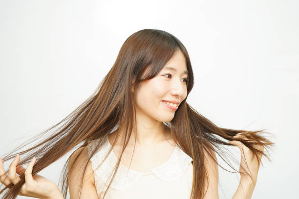 istock Woman touching her hair 688252938