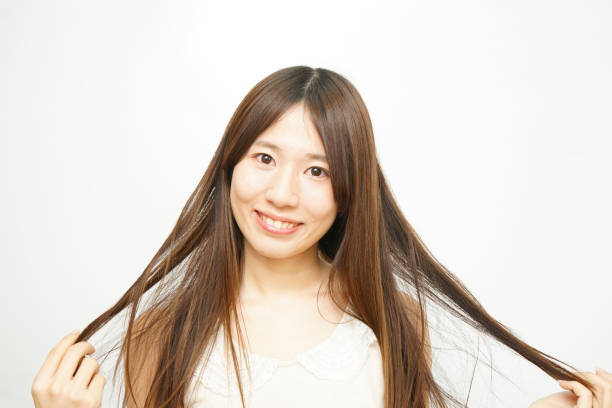 istock Woman touching her hair 688252950