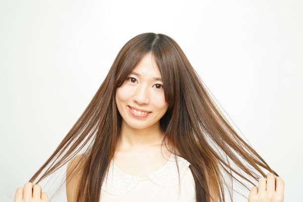 istock Woman touching her hair 688252958