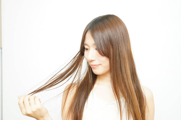 istock Woman touching her hair 688252962