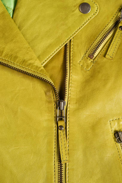 istock Green leather jacket zippers. Leather jacket macro details. Jacket zippers and pockets 688255222