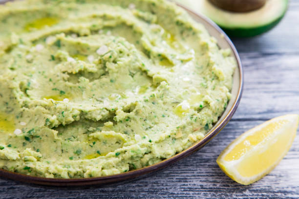istock Healthy avocado hummus with olive oil. vegetarian concept. selective focus 688255578