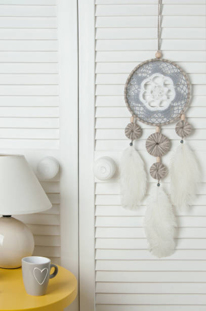 istock Gray white dream catcher on door 688255698