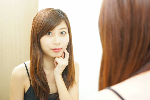 istock Women in front of the mirror 688255908