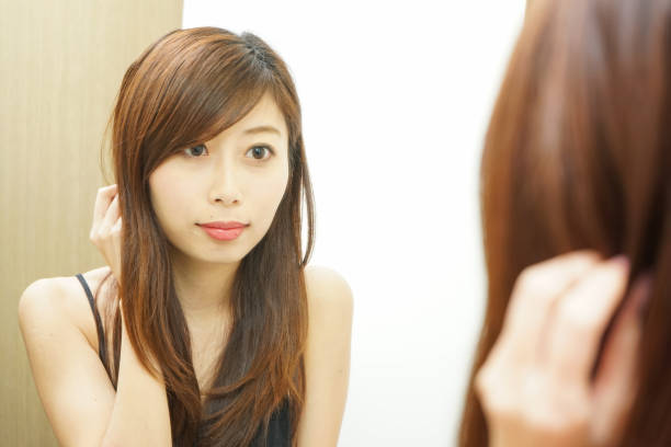 istock Women in front of the mirror 688255922
