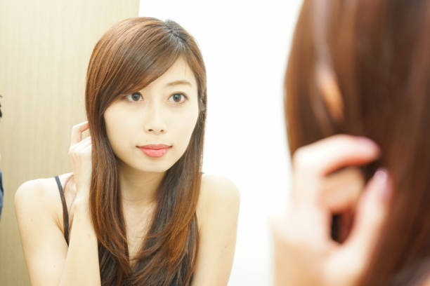 istock Women in front of the mirror 688255938