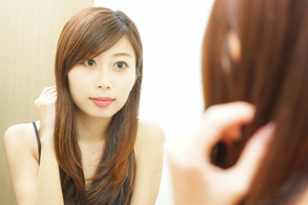 istock Women in front of the mirror 688255942