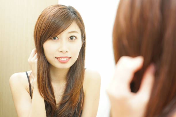 istock Women in front of the mirror 688255970