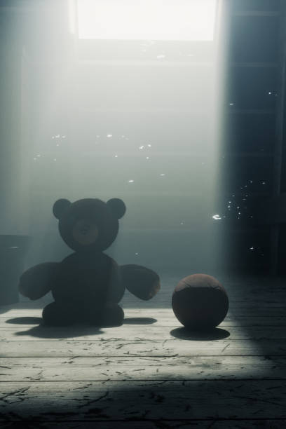teddy bear sitting on the attic floor