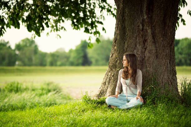 istock Beautiful women relaxing under a chestnut-tree 688271926