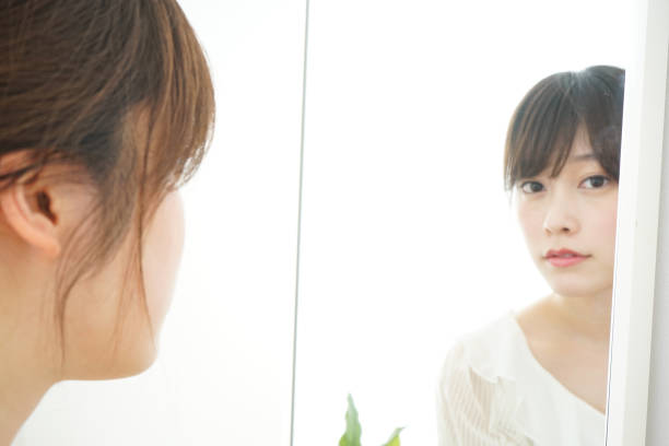istock Women in front of the mirror 688274602