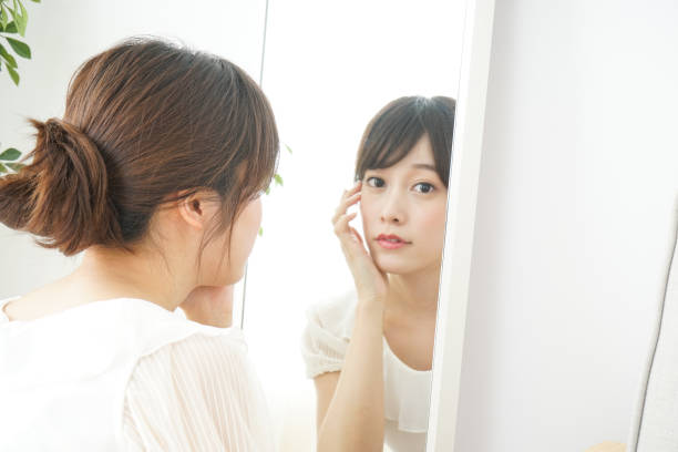 istock Women in front of the mirror 688274608