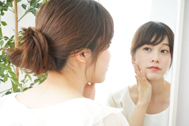 istock Women in front of the mirror 688274664