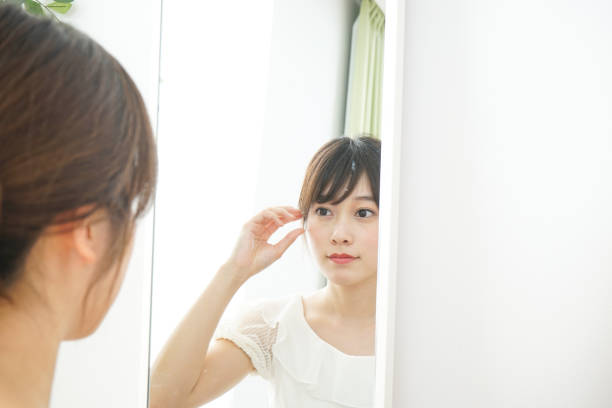 istock Women in front of the mirror 688274680