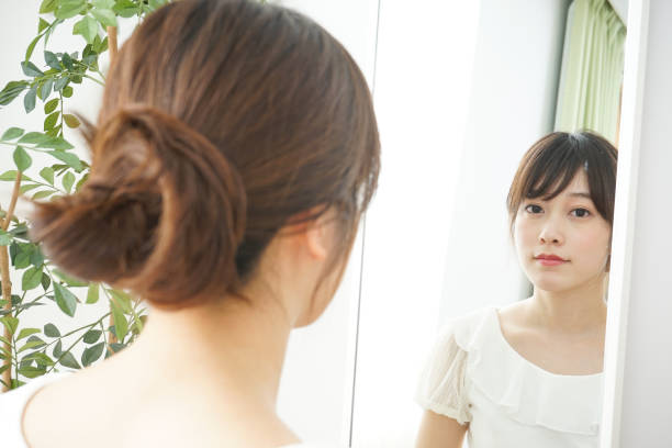 istock Women in front of the mirror 688274686