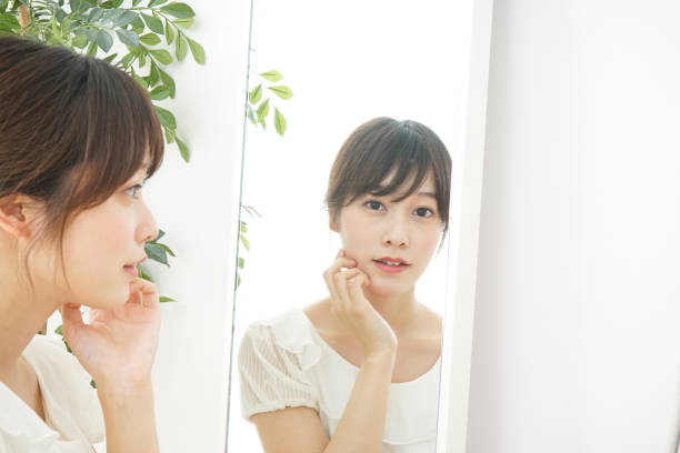 istock Women in front of the mirror 688274714